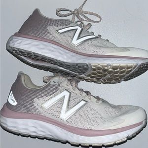 NewBalance FreshFoam 680 running shoes in white with pink and purple accents